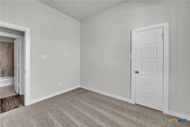 spare room featuring carpet floors