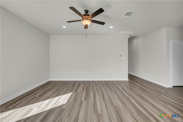 spare room featuring ceiling fan and light wood-type flooring