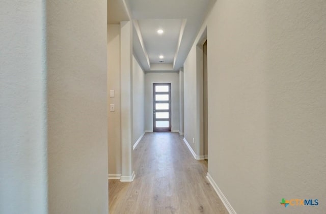 1752 Heritage Maples, New Braunfels, TX 78132 - hall featuring light wood-style flooring, baseboards, and a textured wall