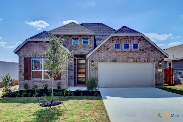 1752 Heritage Maples, New Braunfels, TX 78132 - view of front of home featuring brick siding, concrete driveway, and roof with shingles