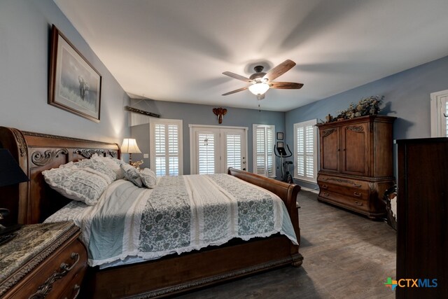 bedroom with ceiling fan and dark carpet