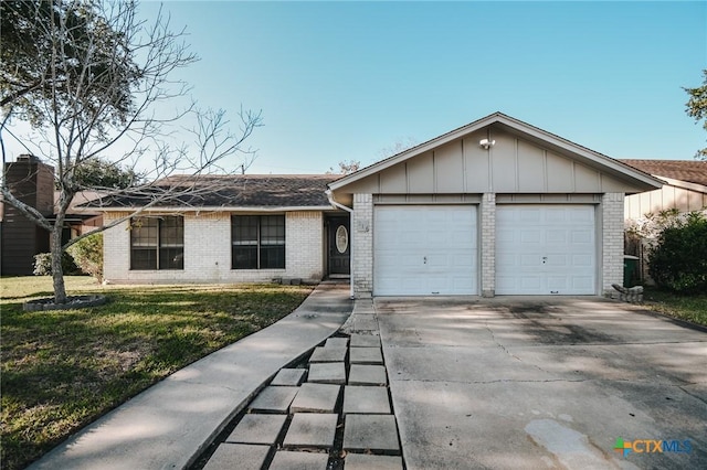 ranch-style home with brick siding, board and batten siding, an attached garage, and a front lawn