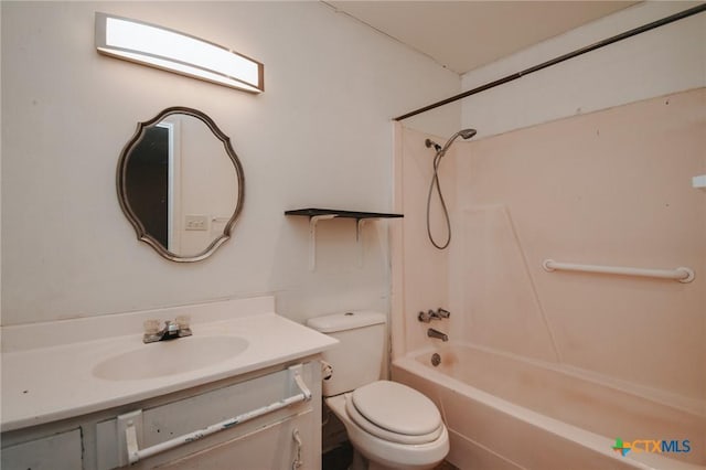 full bathroom with bathtub / shower combination, vanity, and toilet