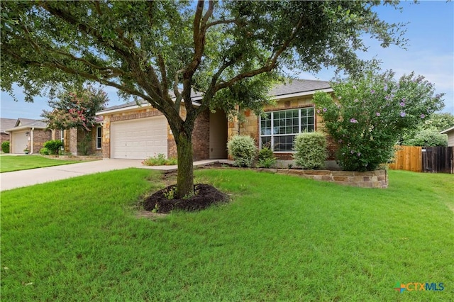 5928 Alexandria Dr, Temple, TX 76502 - view of front of house with an attached garage, concrete driveway, and brick siding