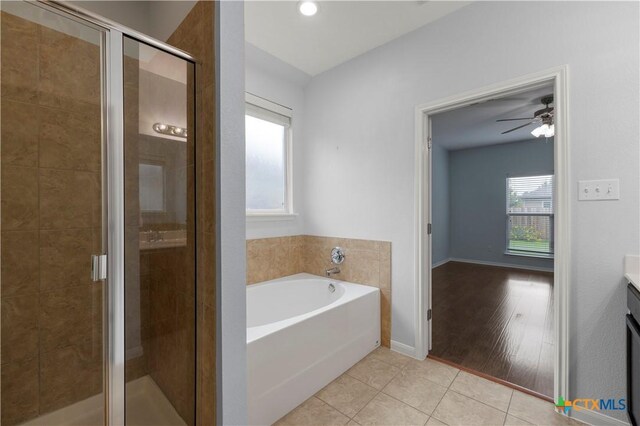 5928 Alexandria Dr, Temple, TX 76502 - full bathroom featuring a garden tub, vanity, tile patterned floors, a shower stall, and ceiling fan