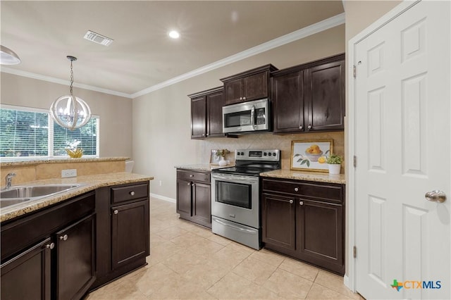 5928 Alexandria Dr, Temple, TX 76502 - kitchen with stainless steel appliances, backsplash, ornamental molding, a chandelier, and dark brown cabinetry