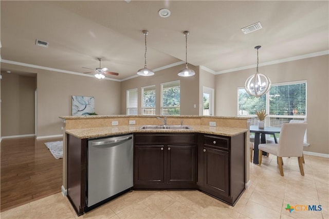 5928 Alexandria Dr, Temple, TX 76502 - kitchen with stainless steel dishwasher, ornamental molding, dark brown cabinets, decorative light fixtures, and an island with sink