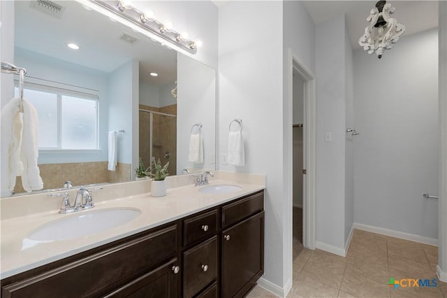 5928 Alexandria Dr, Temple, TX 76502 - full bath with a shower stall, double vanity, a walk in closet, and tile patterned floors