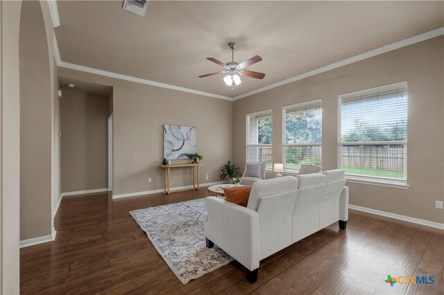 5928 Alexandria Dr, Temple, TX 76502 - living area featuring a ceiling fan, crown molding, and dark wood-style flooring