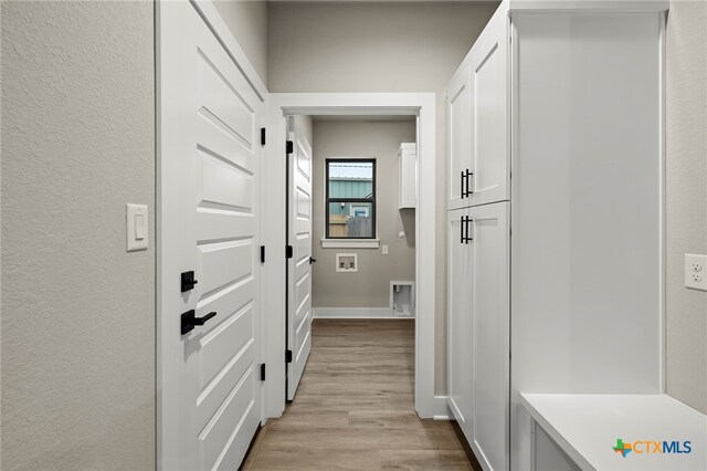 corridor featuring light wood-type flooring