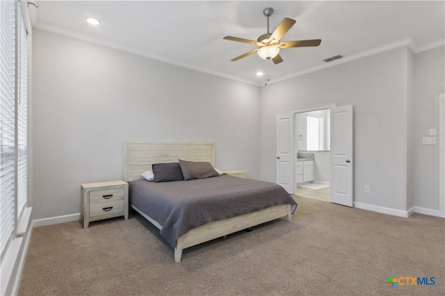 bedroom featuring ensuite bathroom, ceiling fan, carpet flooring, and ornamental molding