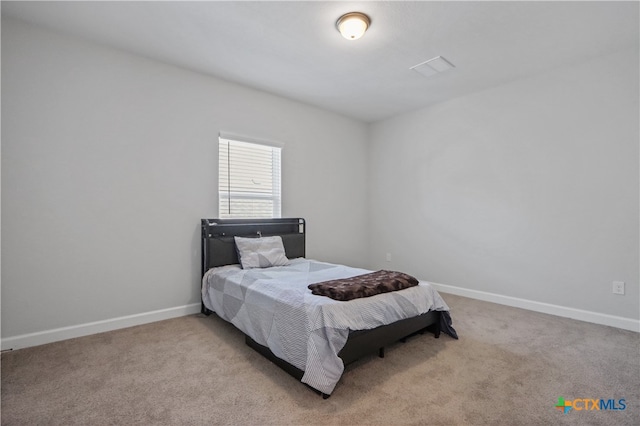 bedroom with light carpet