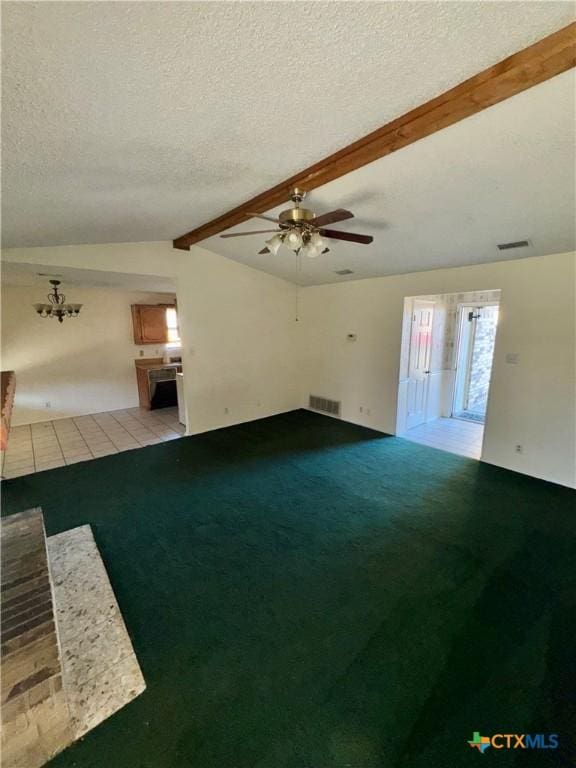 unfurnished living room featuring vaulted ceiling with beams, a textured ceiling, light colored carpet, and ceiling fan