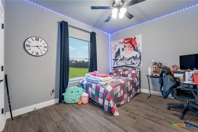 bedroom with hardwood / wood-style floors and ceiling fan