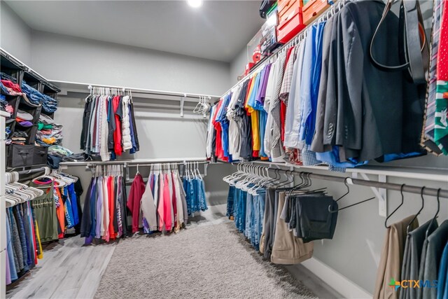 walk in closet featuring hardwood / wood-style flooring