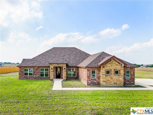 view of front of home with a front yard