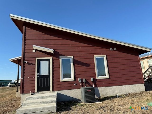 back of house with cooling unit