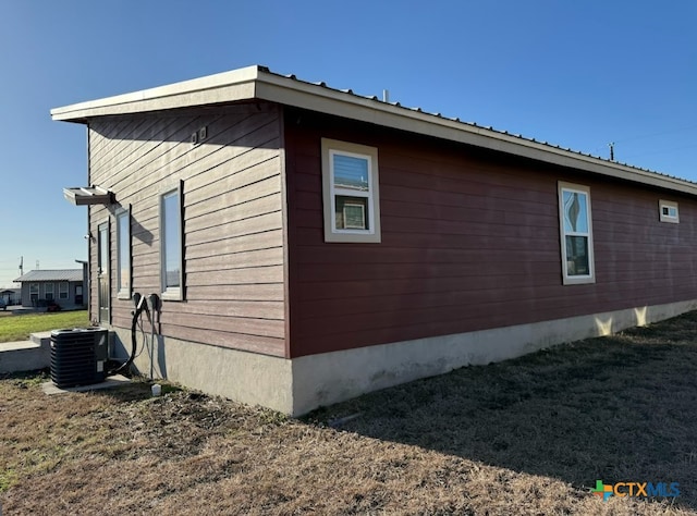 view of side of home with cooling unit