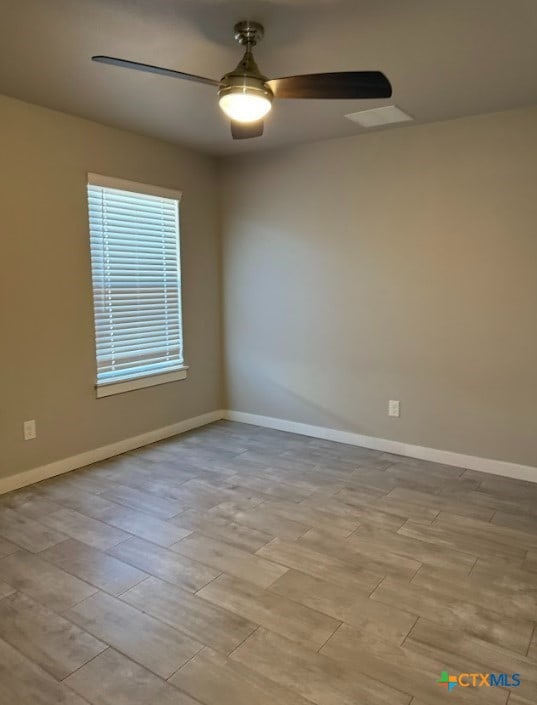 unfurnished room featuring ceiling fan