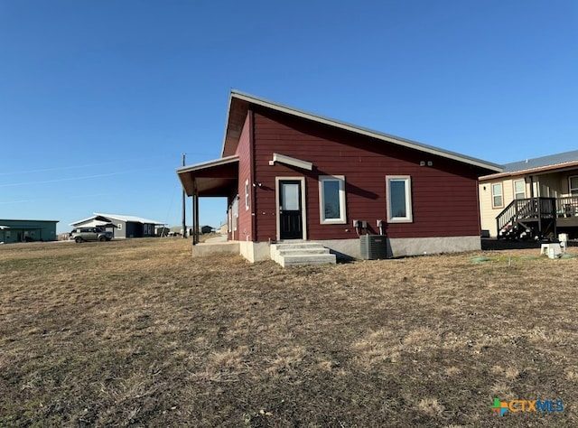 view of home's exterior with central AC unit