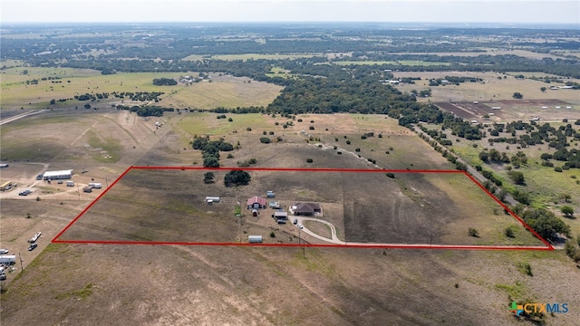 birds eye view of property with a rural view