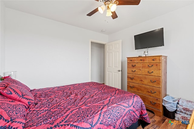 bedroom with hardwood / wood-style floors and ceiling fan