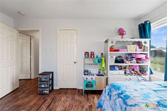 bedroom featuring dark wood-type flooring