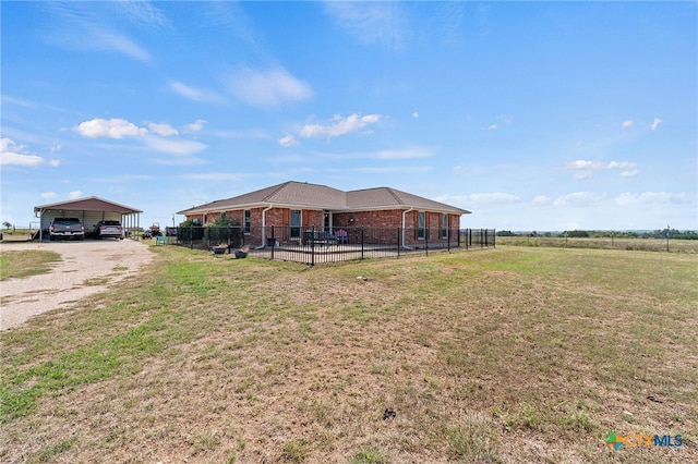 view of yard featuring a carport and a rural view