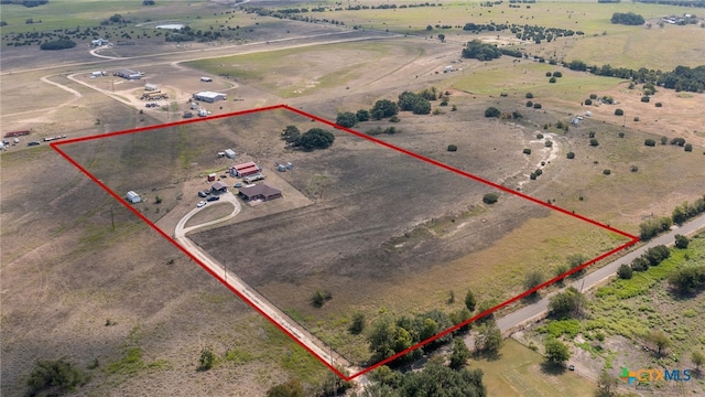 birds eye view of property featuring a rural view