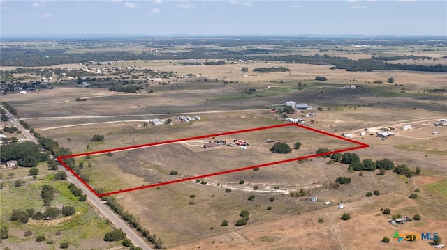 birds eye view of property featuring a rural view