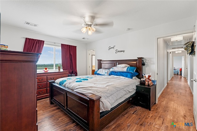 bedroom with ceiling fan and wood-type flooring