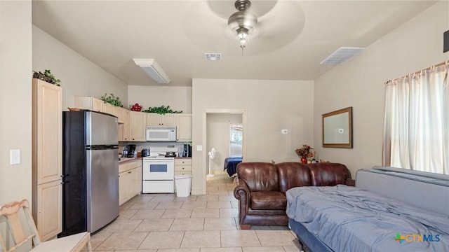 160 E Klein Rd, New Braunfels, TX 78130 - bedroom featuring freestanding refrigerator and light tile patterned floors