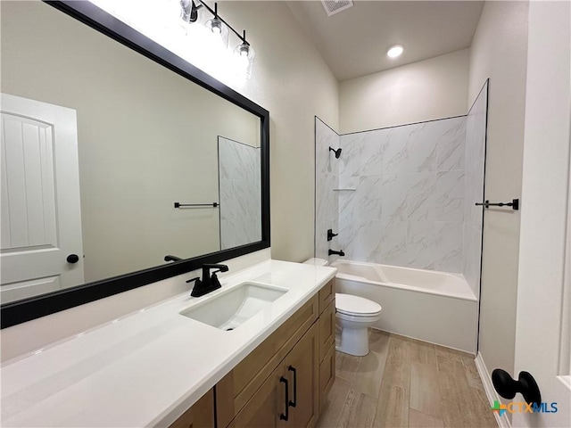 503 Magnolia Dr, Troy, TX 76579 - bathroom featuring vanity, toilet, wood finished floors, and shower / bath combination