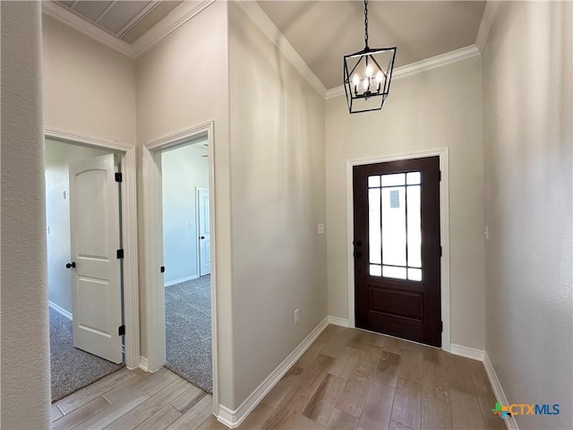 503 Magnolia Dr, Troy, TX 76579 - foyer entrance featuring light wood-style flooring, a chandelier, ornamental molding, and baseboards