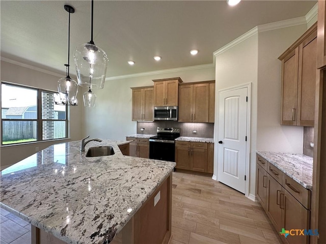 503 Magnolia Dr, Troy, TX 76579 - kitchen with electric stove, stainless steel microwave, a sink, brown cabinets, and a large island with sink