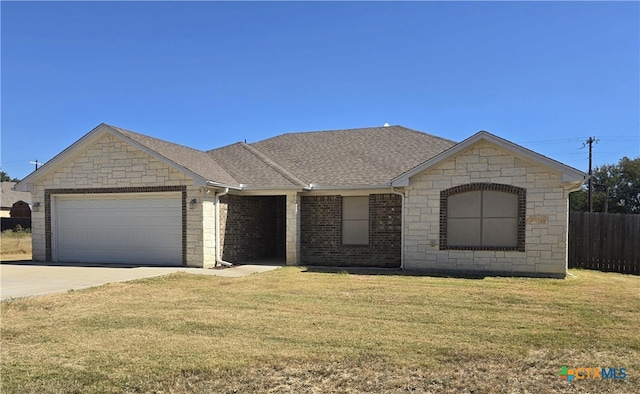 ranch-style home featuring a garage and a front lawn