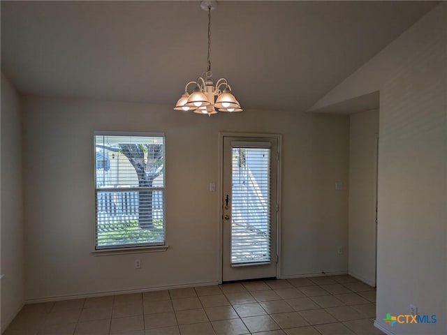 interior space featuring a chandelier and lofted ceiling