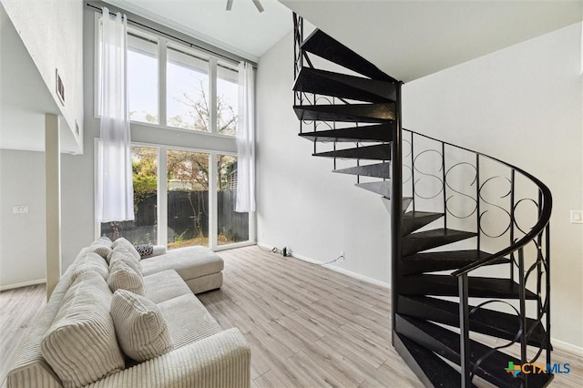 3300 Yorktown St Unit 13, Houston, TX 77056 - staircase featuring a high ceiling and wood finished floors
