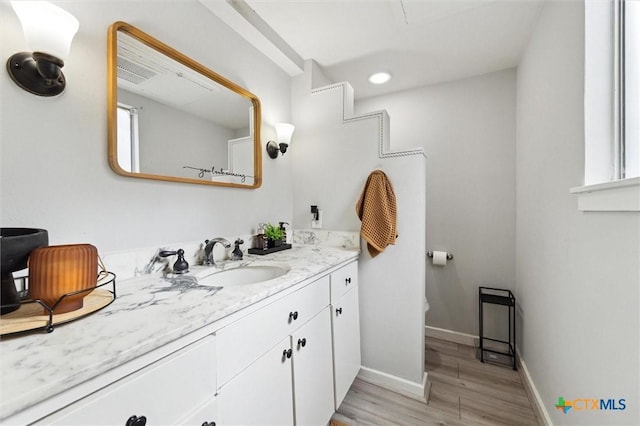 3300 Yorktown St Unit 13, Houston, TX 77056 - bathroom featuring vanity, wood finished floors, and recessed lighting