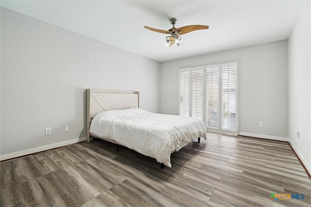 3300 Yorktown St Unit 13, Houston, TX 77056 - bedroom with wood finished floors, access to exterior, and ceiling fan