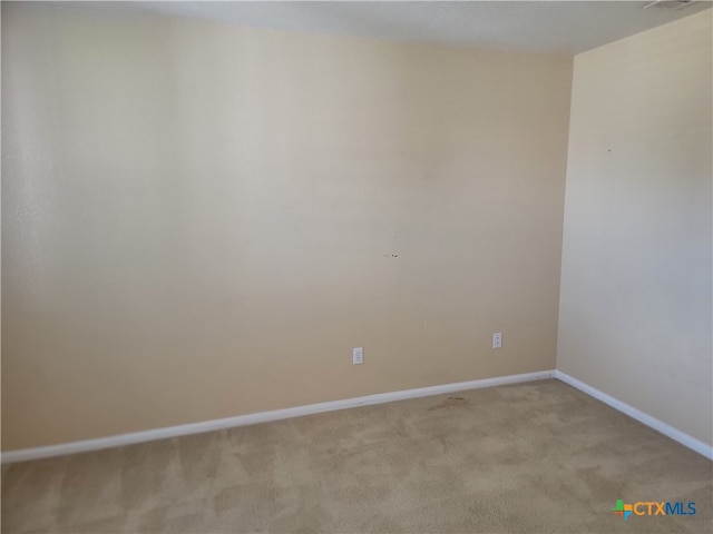 unfurnished room with light colored carpet