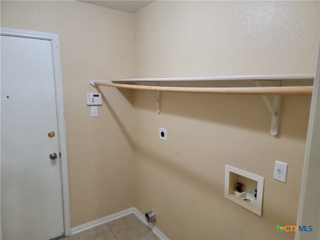 laundry area featuring hookup for a washing machine, light tile patterned floors, and hookup for an electric dryer