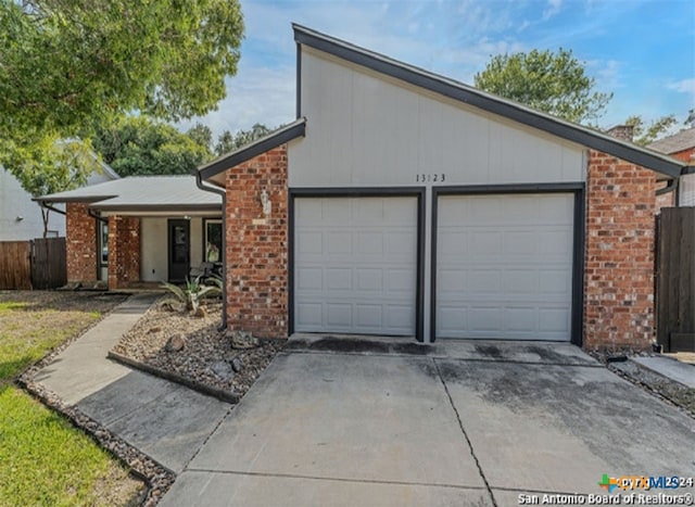 ranch-style house featuring a garage