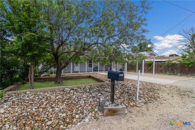 obstructed view of property with fence