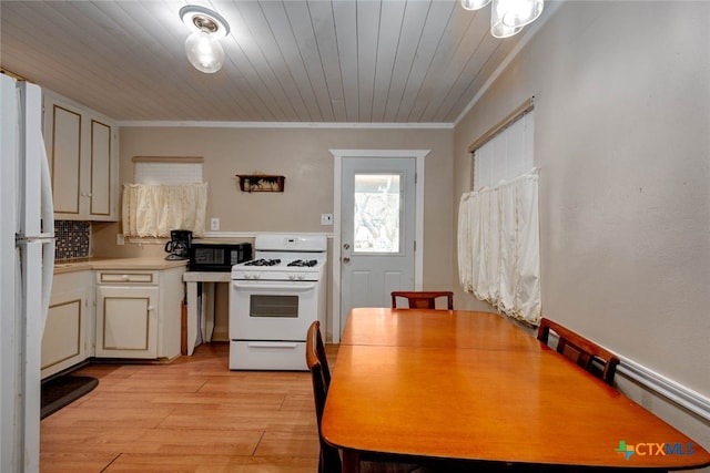 kitchen with light wood-style flooring, white appliances, wooden ceiling, crown molding, and light countertops