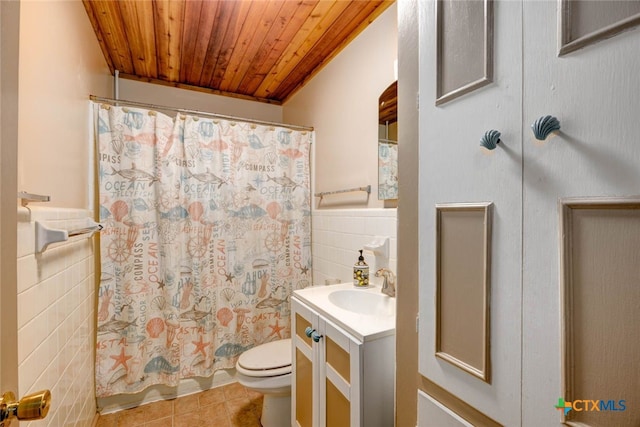 full bathroom featuring tile walls, toilet, wood ceiling, tile patterned floors, and vanity