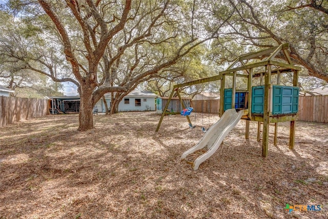 view of jungle gym with a fenced backyard