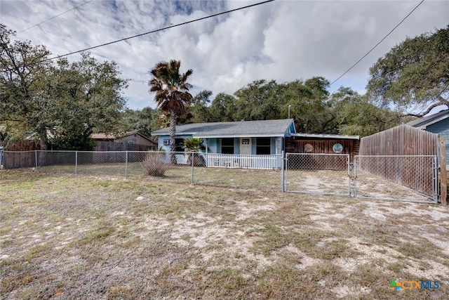 back of house with a gate and fence private yard