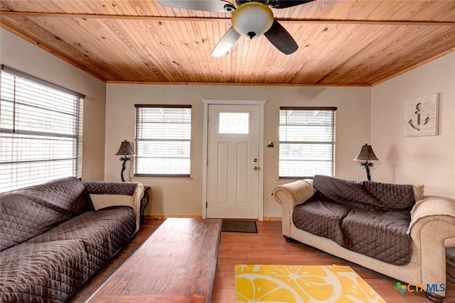 living room featuring a healthy amount of sunlight, wood ceiling, and wood finished floors