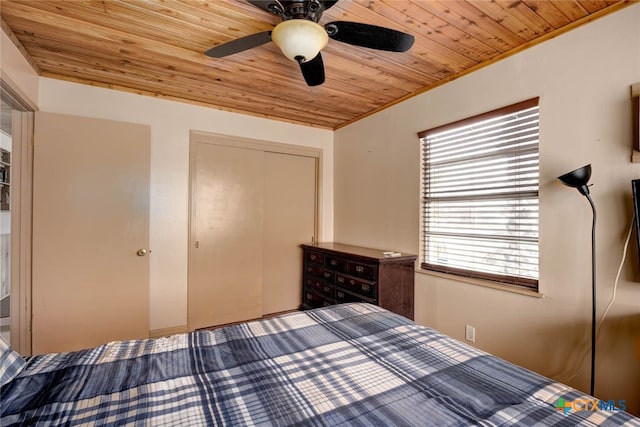 unfurnished bedroom featuring a closet, wood ceiling, and ceiling fan